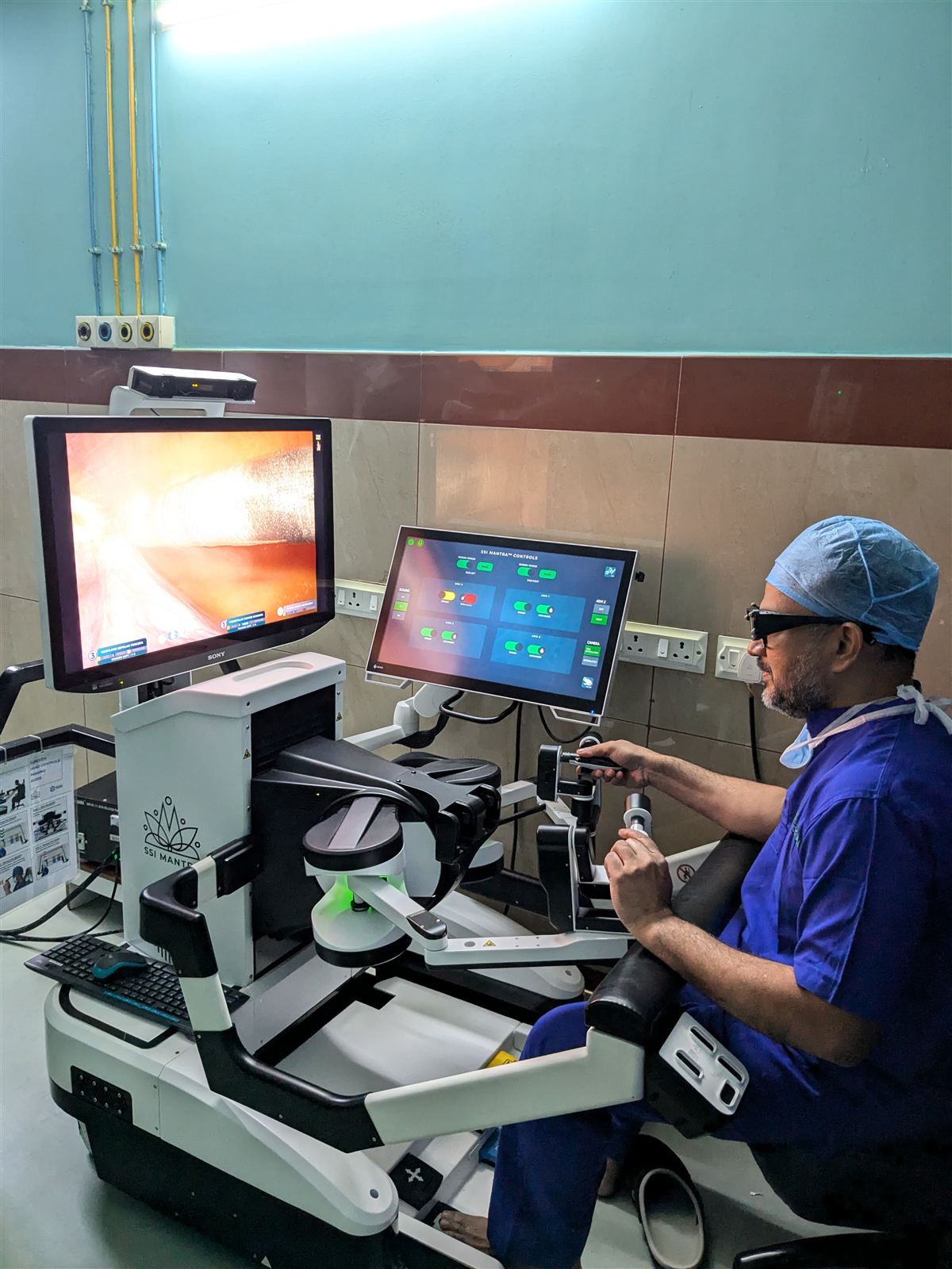 Dr. Rohan Shetty operating the SSI Mantra robotic surgery console